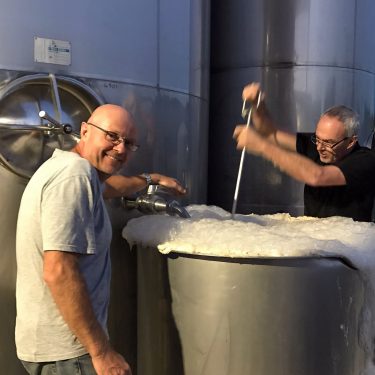 Kevin and brother Steve getting a Sauvignon Blanc fermentation going